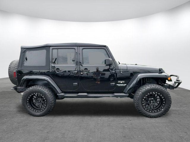 Used 2016 Jeep Wrangler Unlimited Sahara with VIN 1C4BJWEG5GL105057 for sale in Gardendale, AL