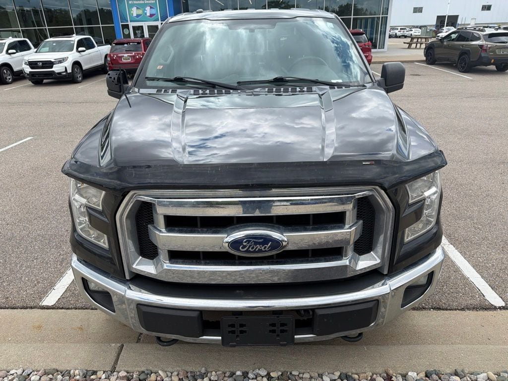 Used 2015 Ford F-150 XLT with VIN 1FTEW1E84FFB99651 for sale in Grandville, MI
