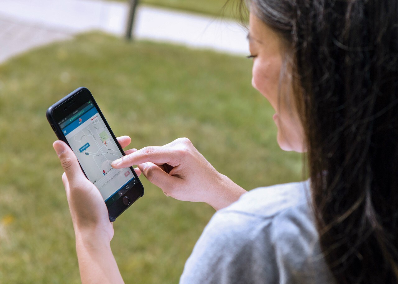 woman receiving pizza delivery updates