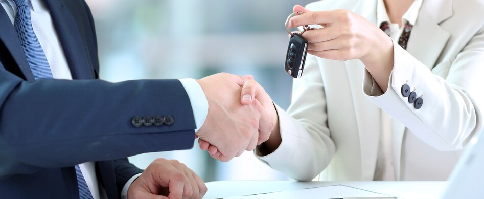 Person cheerfully signing documents.