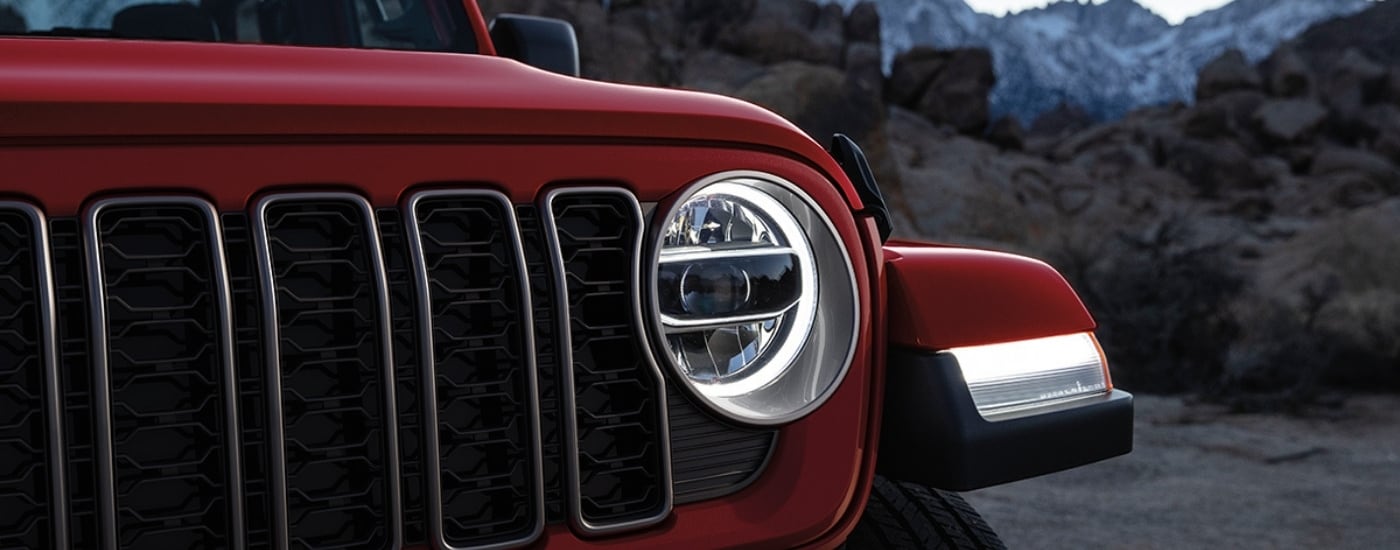 Passenger side headlight on a red 2024 Jeep Gladiator