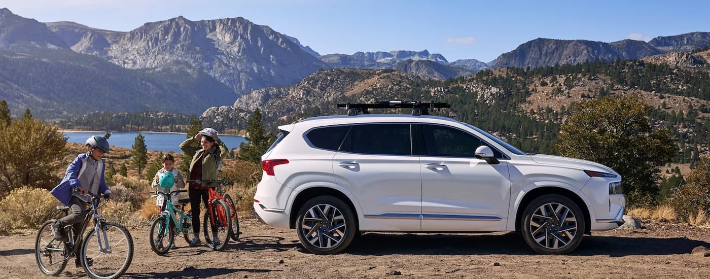 A family of bikers unloading their 2023 Hyundai Santa Fe
