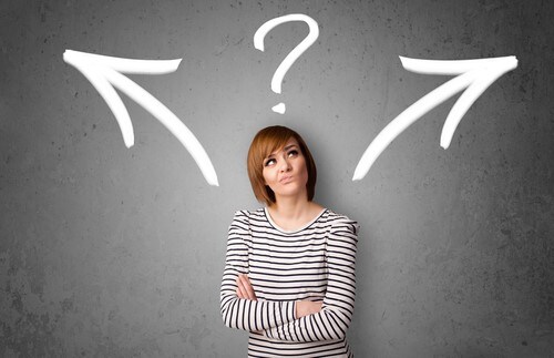 Woman thinking aobut why it's a good idea to buy a used car - Used Car Dealer near Plymouth CT