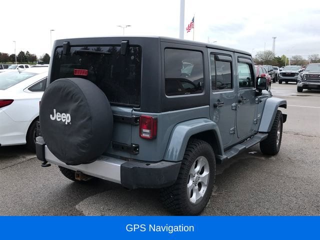 Used 2014 Jeep Wrangler Unlimited Sahara with VIN 1C4BJWEG8EL252003 for sale in Flint Township, MI