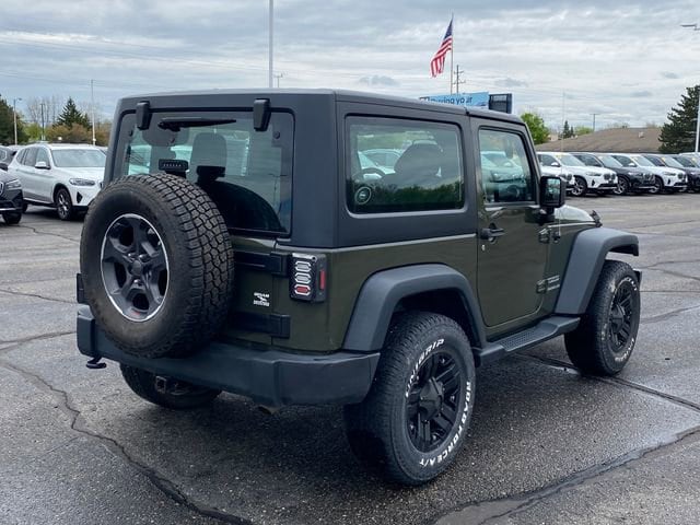 Used 2015 Jeep Wrangler Sport with VIN 1C4AJWAG3FL699017 for sale in Flint Township, MI