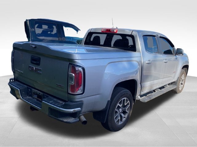 Used 2015 GMC Canyon SLE with VIN 1GTG6BE38F1184487 for sale in Flint Township, MI