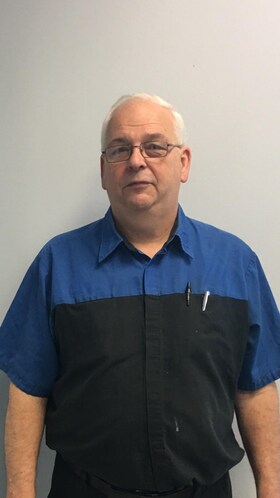 Staff member Tim Barrett from ID_39ed890322bd