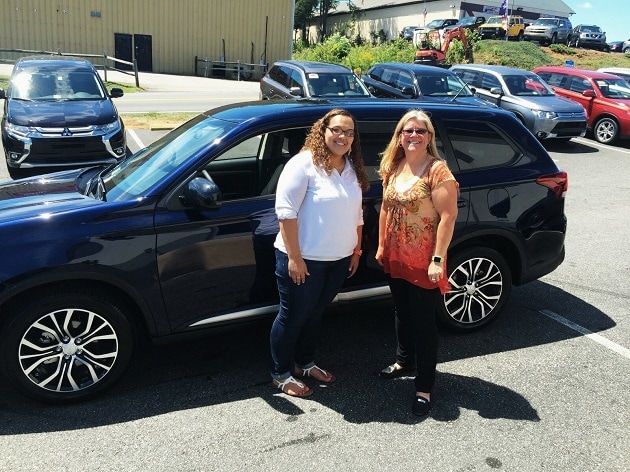 Salesperson Dawn DeChristopher with Happy Customer Deserae Barney and her brand new 2016 Mitsubishi Outlander.