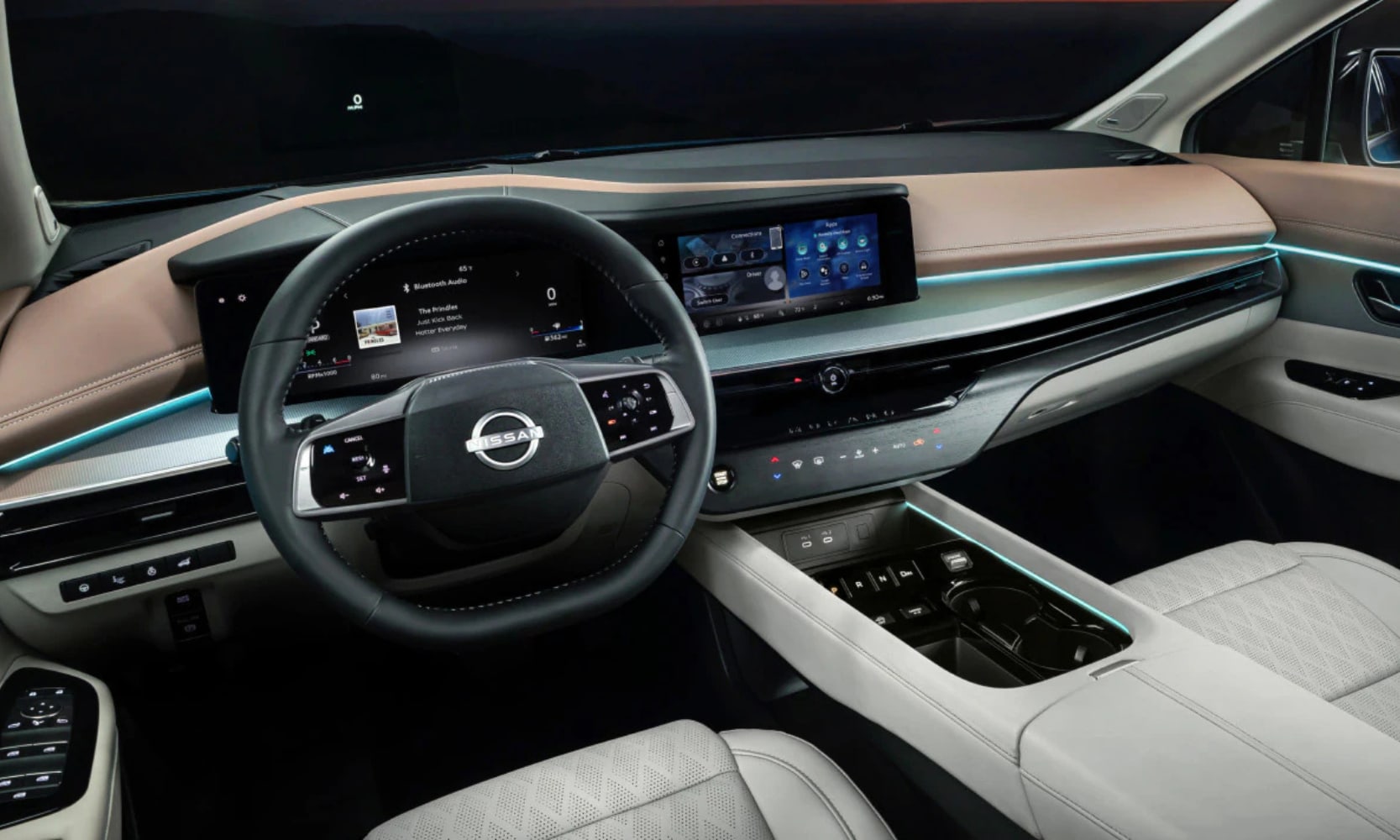 Interior image of a 2025 Nissan Murano's white and tan front seat area, infotainment system, and dashboard