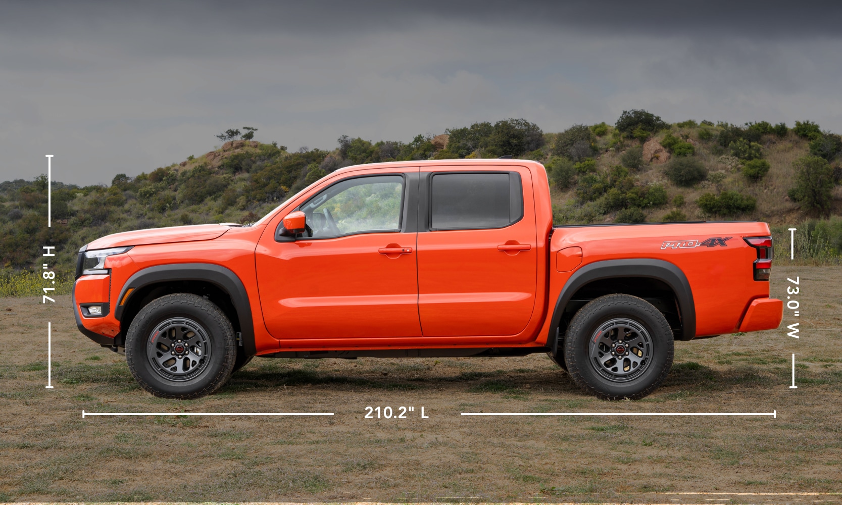 A side image graphic of an orange 2025 Nissan Frontier exterior dimensions parked in an open field with trees behind it