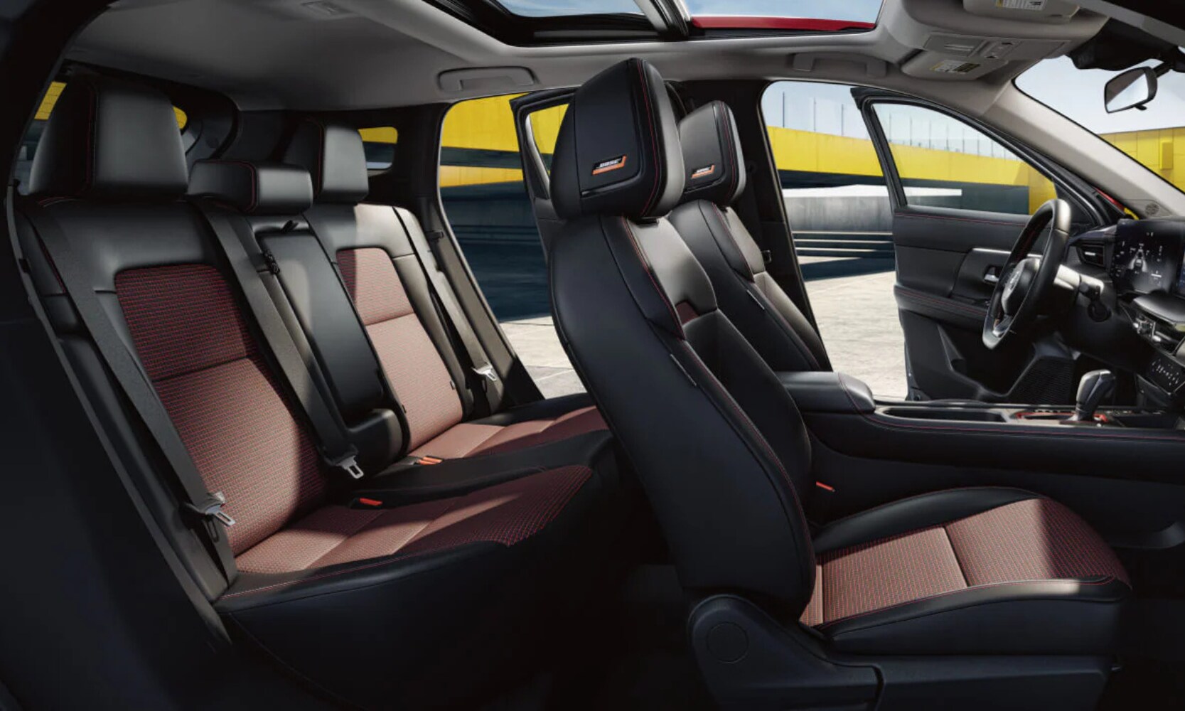 Interior image of the 2026 Nissan Kicks black and red two-row seating with the doors open