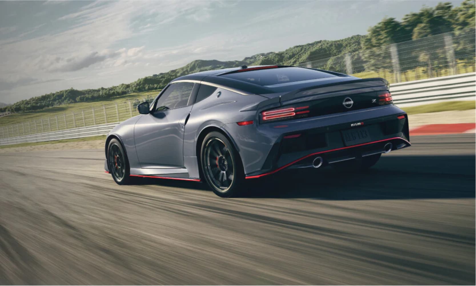 Rear-view image of a gray 2025 Nissan Z NISMO driving down a racetrack