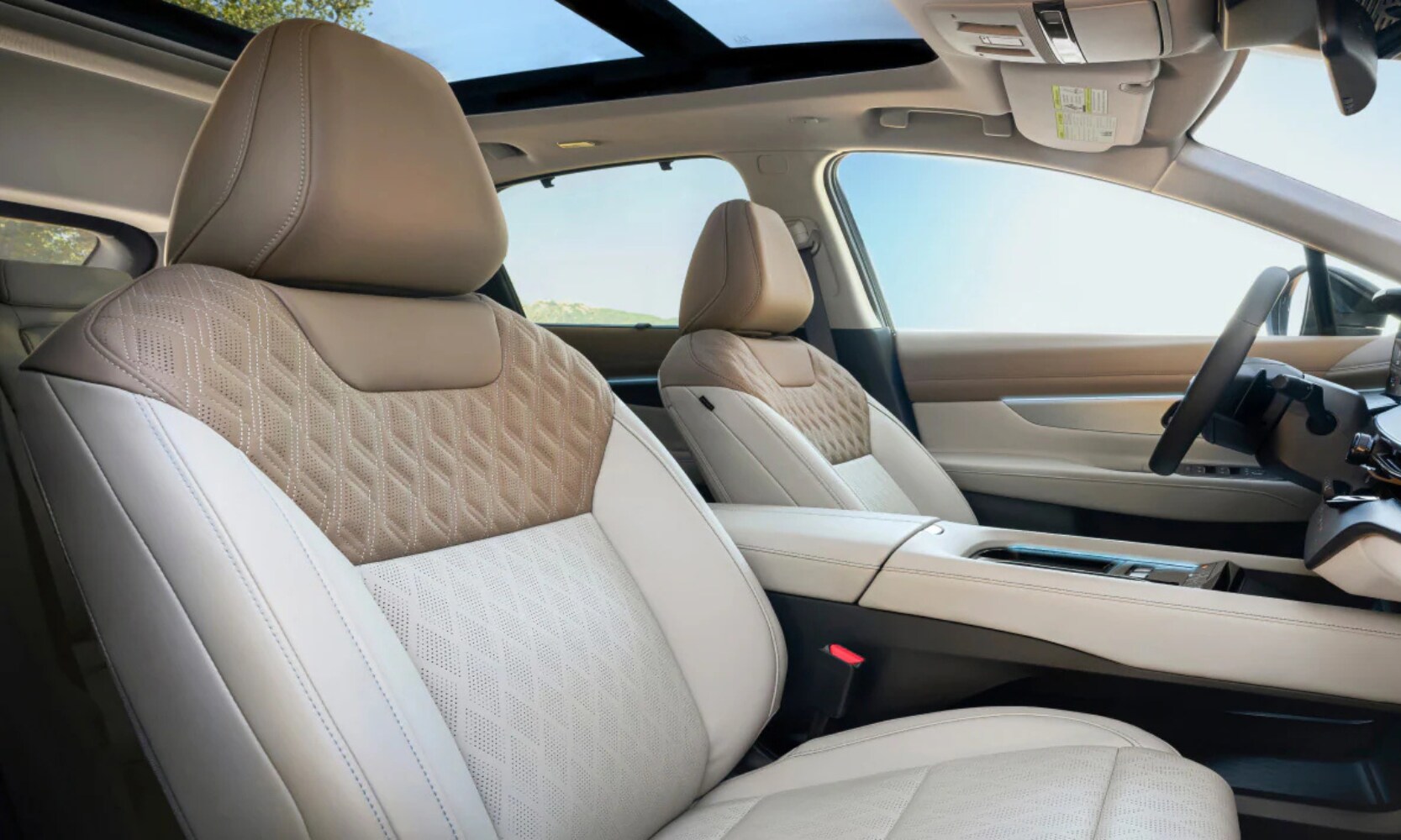 Interior image of the 2025 Nissan Murano white and tan front leather seating area