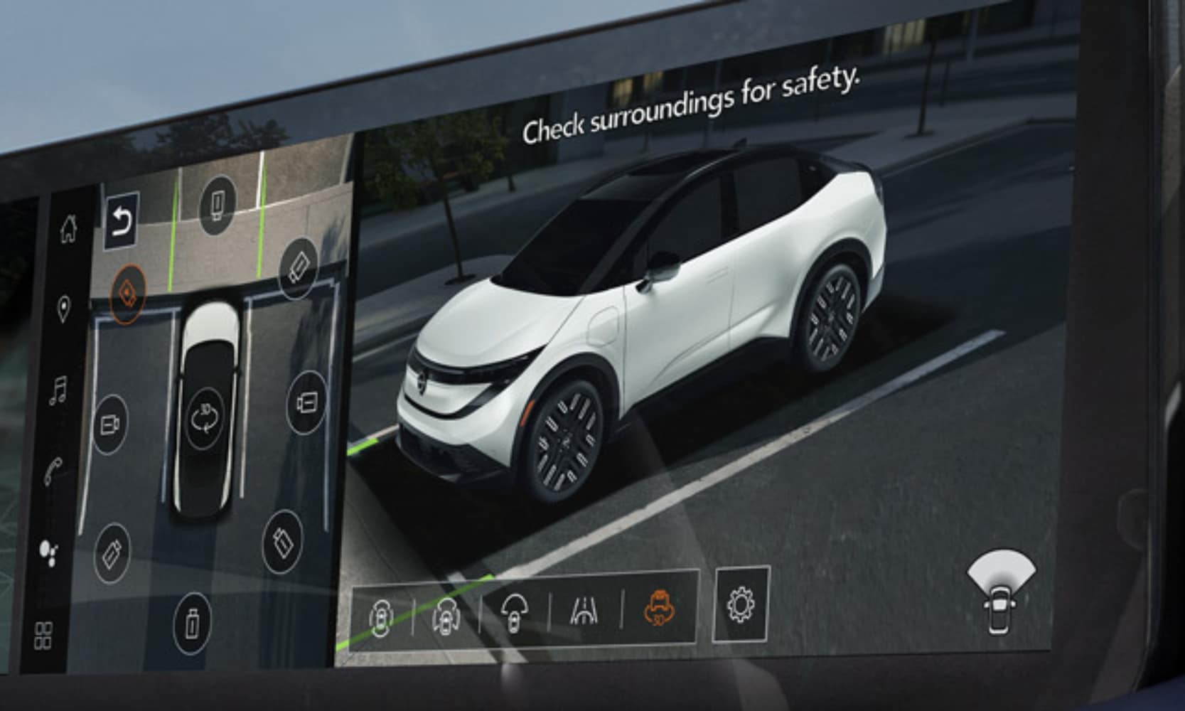 Closeup image of a white 2026 Nissan LEAF parked from the Intelligent Around View Monitor camera system perspective
