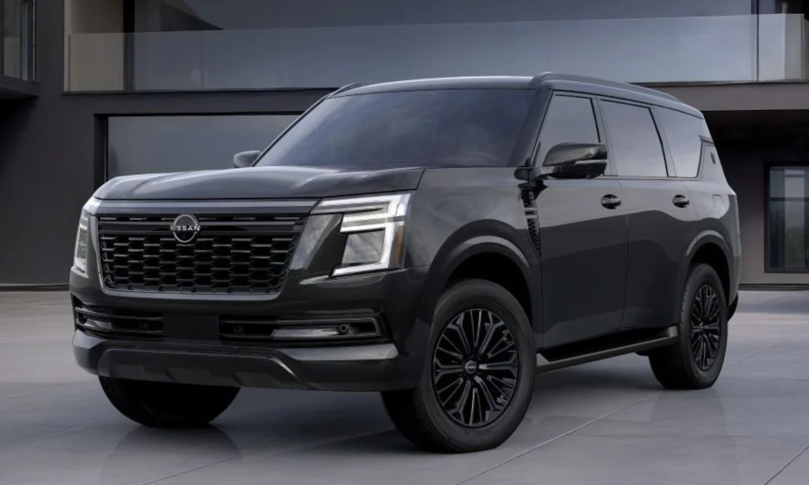 Exterior image of a black 2027 Nissan Armada Dark Armor parked outside a building