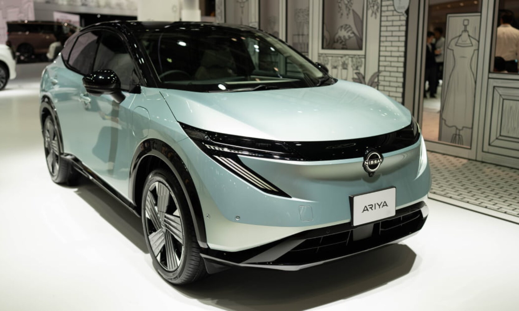 Exterior front angle image of a light aqua blue 2026 Nissan LEAF at the2025 Japan Mobility Show