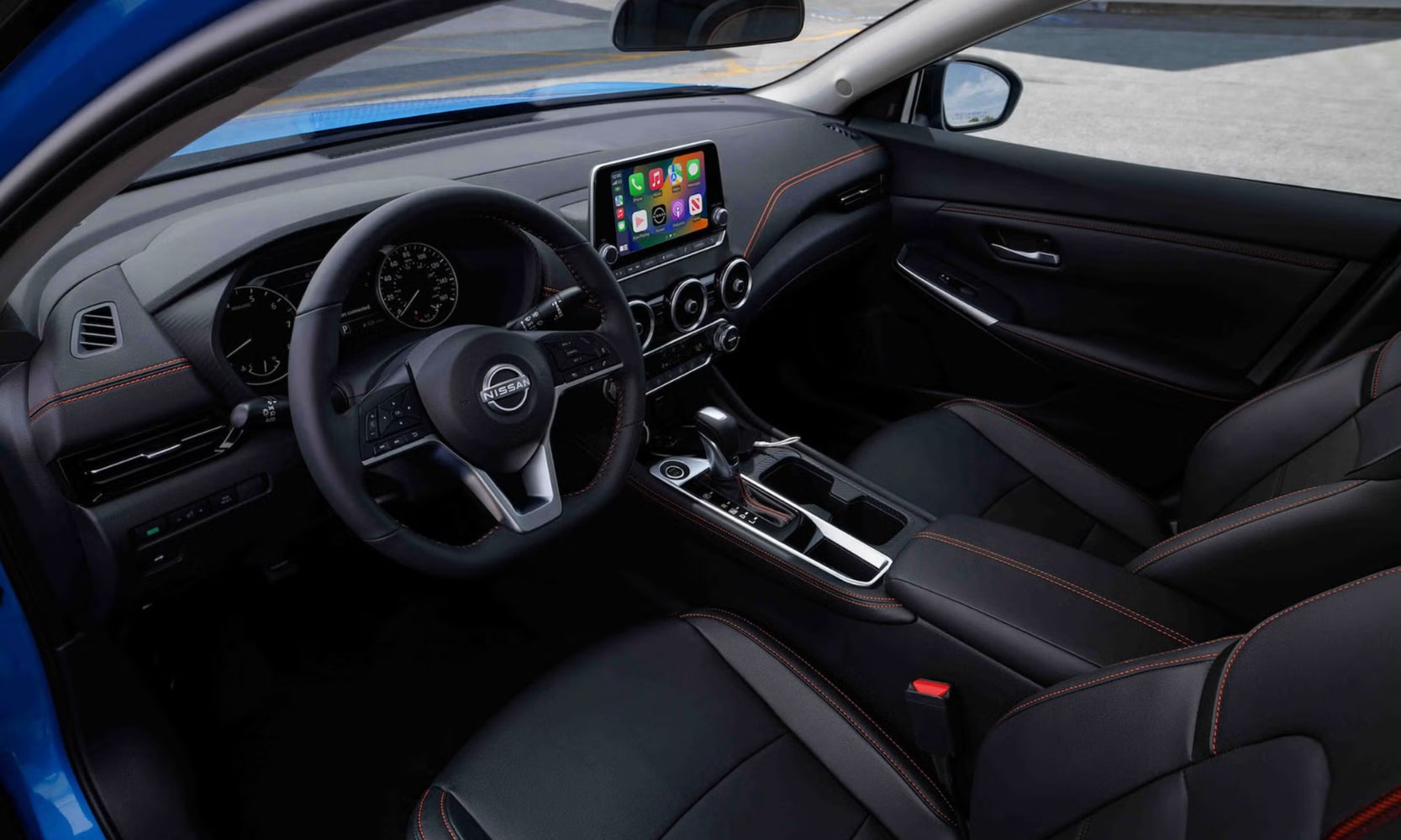 Interior image of a blue 2024 Nissan Sentra SR front seating area