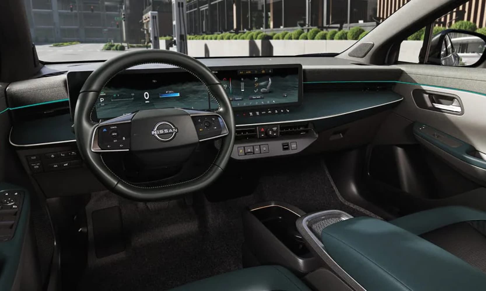 Interior image of a 2026 Nissan LEAF front-row seating area with city views in the windshield