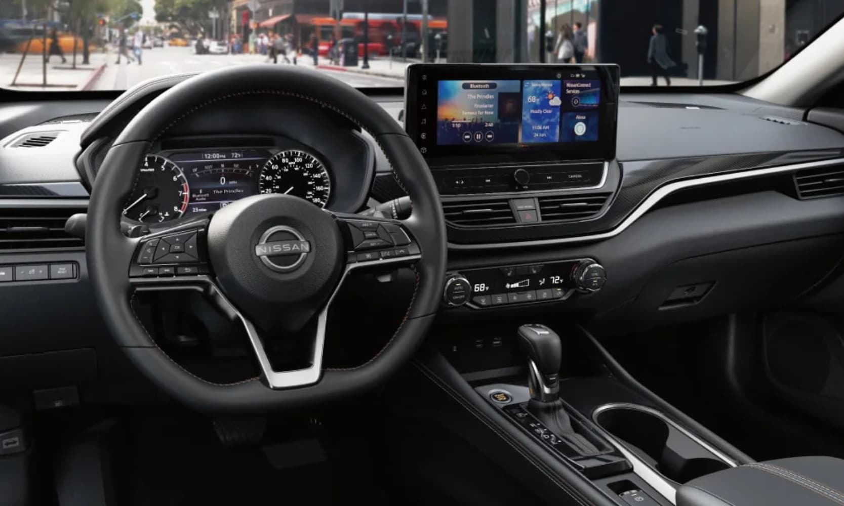 Interior image of a 2025 Nissan Altima front seating area and dashboard in a city street during the day