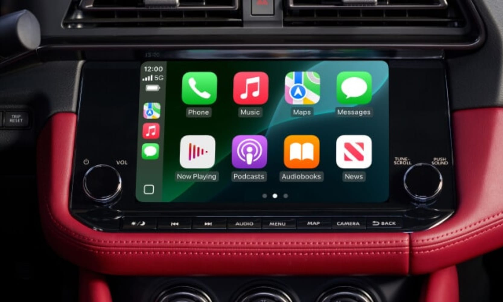 Closeup image of the 2025 Nissan Z infotainment system with a red leather dashboard