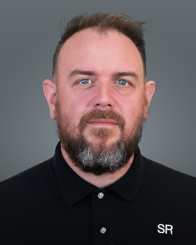 Staff member Jason Brewster from ID_283275