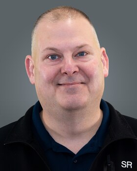 Staff member John Delanoy from ID_54268a
