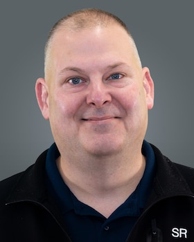 Staff member John Delanoy from ID_54268a