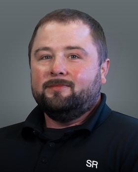 Staff member Travis Johns from ID_283275