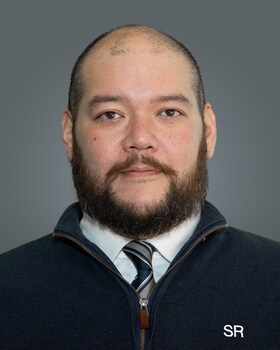 Staff member Zachary Odo from ID_b5d370