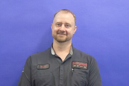 Staff member Brett Sewell from 8479604501e0