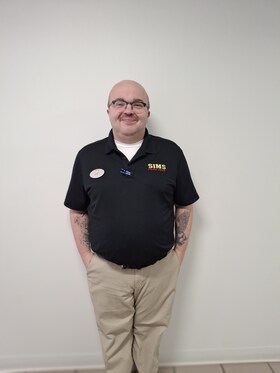 Staff member Joshua Floyd from 56624cd63388