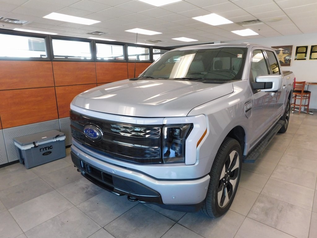 Used 2022 Ford F-150 Lightning Platinum with VIN 1FT6W1EV3NWG07128 for sale in Sioux City, IA