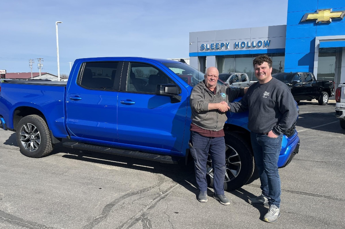Sleepy Hollow Auto Group team delivering a vehicle to a customer in Viroqua, WI