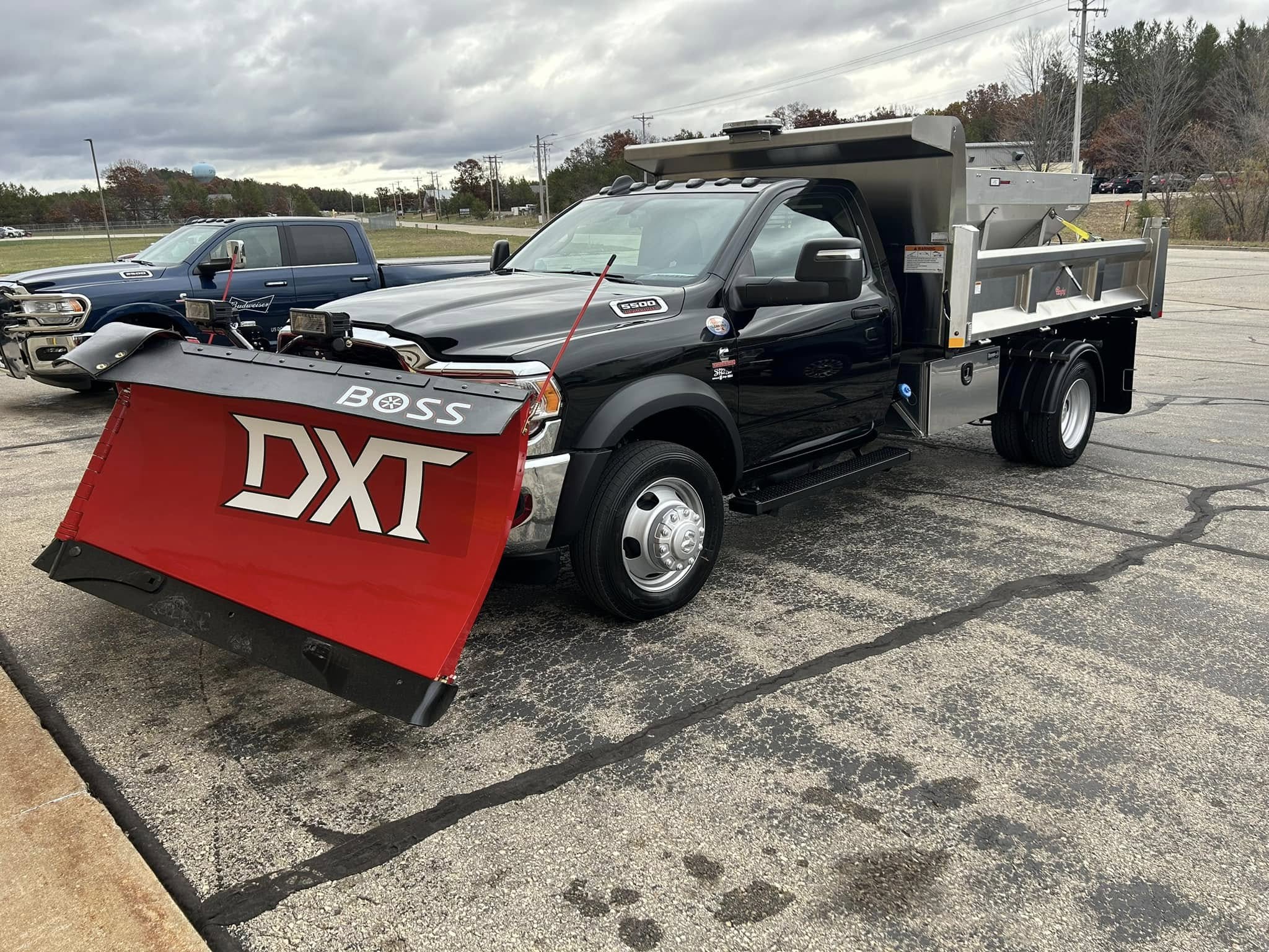 Municipal dump truck with a Rugby dump body and a snow plow for public works