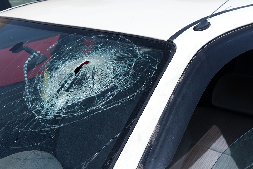 Severely cracked windshield requiring replacement