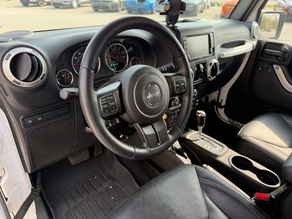Used 2015 Jeep Wrangler Unlimited Rubicon with VIN 1C4HJWFG2FL613090 for sale in Amherst, OH