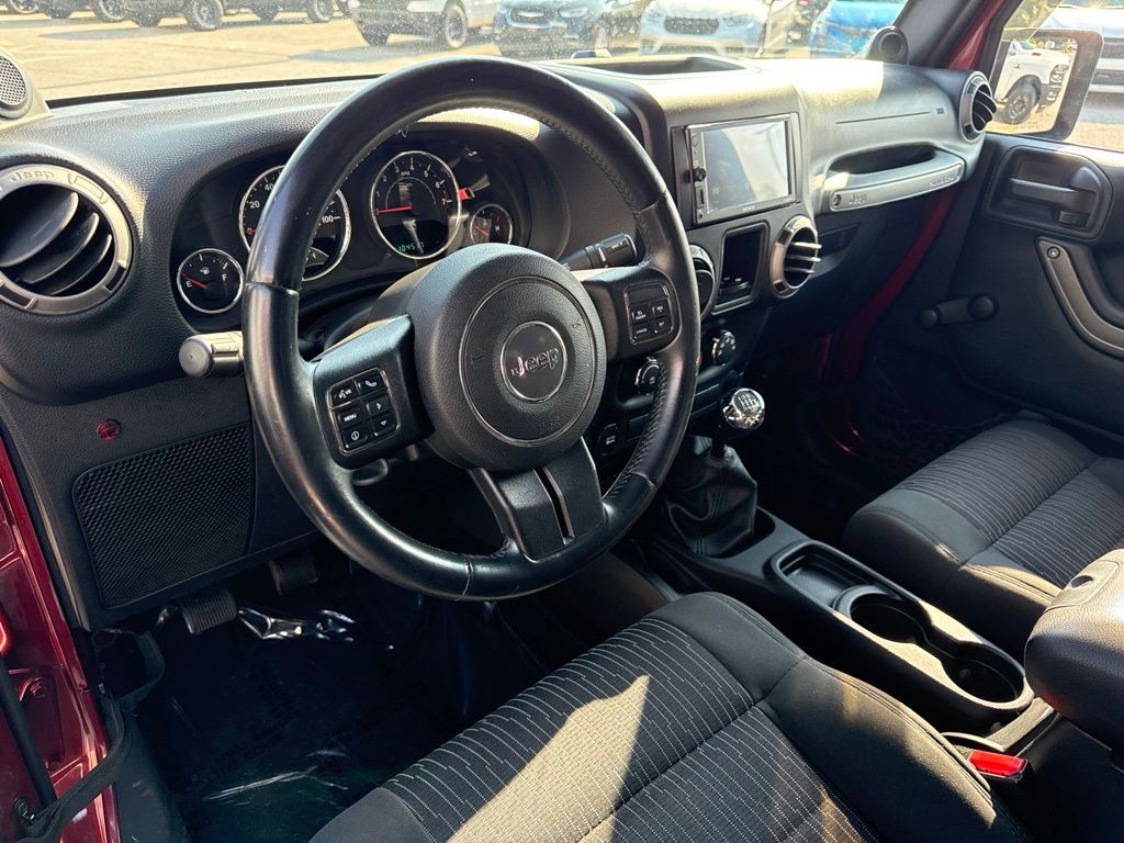Used 2012 Jeep Wrangler Sport with VIN 1C4AJWAGXCL287009 for sale in Amherst, OH