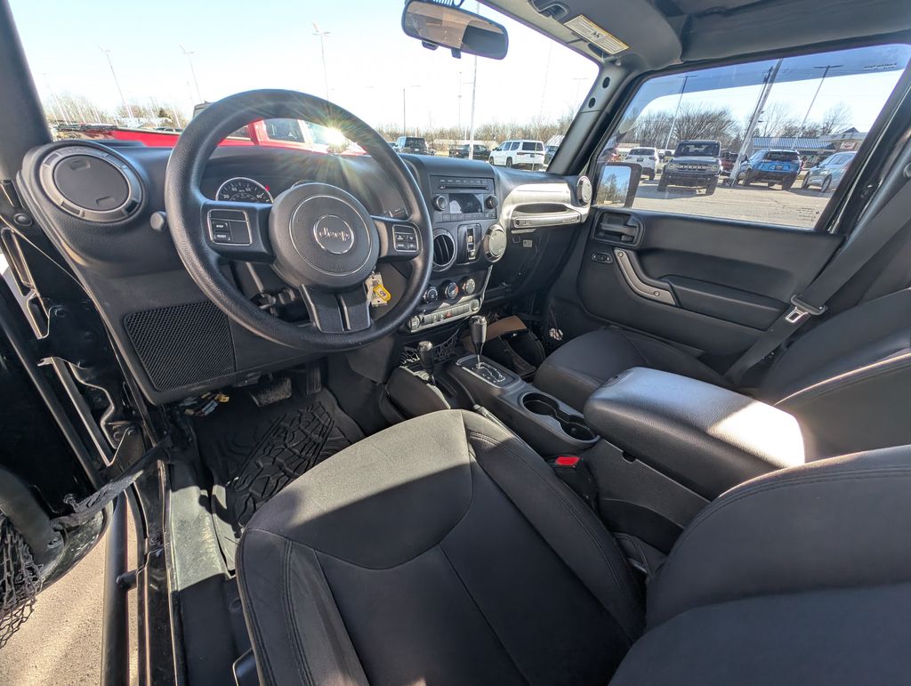 Used 2016 Jeep Wrangler Unlimited Sport with VIN 1C4BJWDG9GL199235 for sale in Amherst, OH