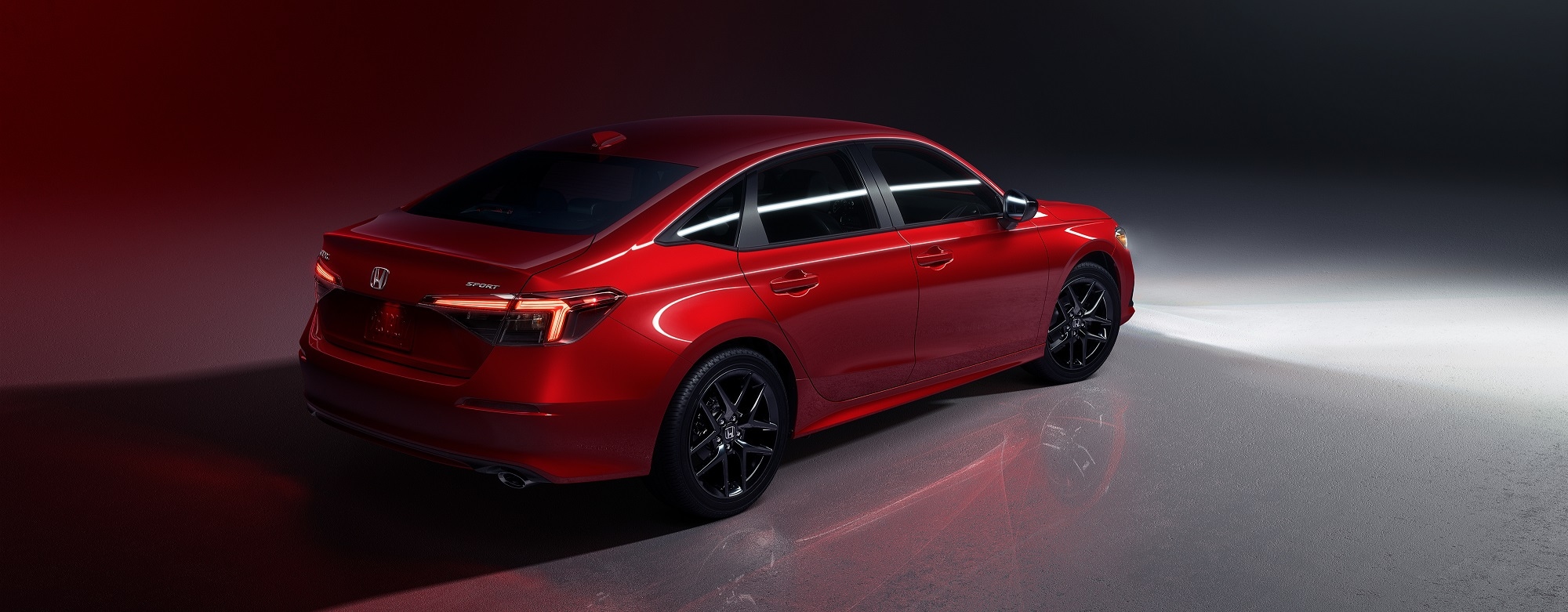 New 2022 Red Honda Civic Sport on display.