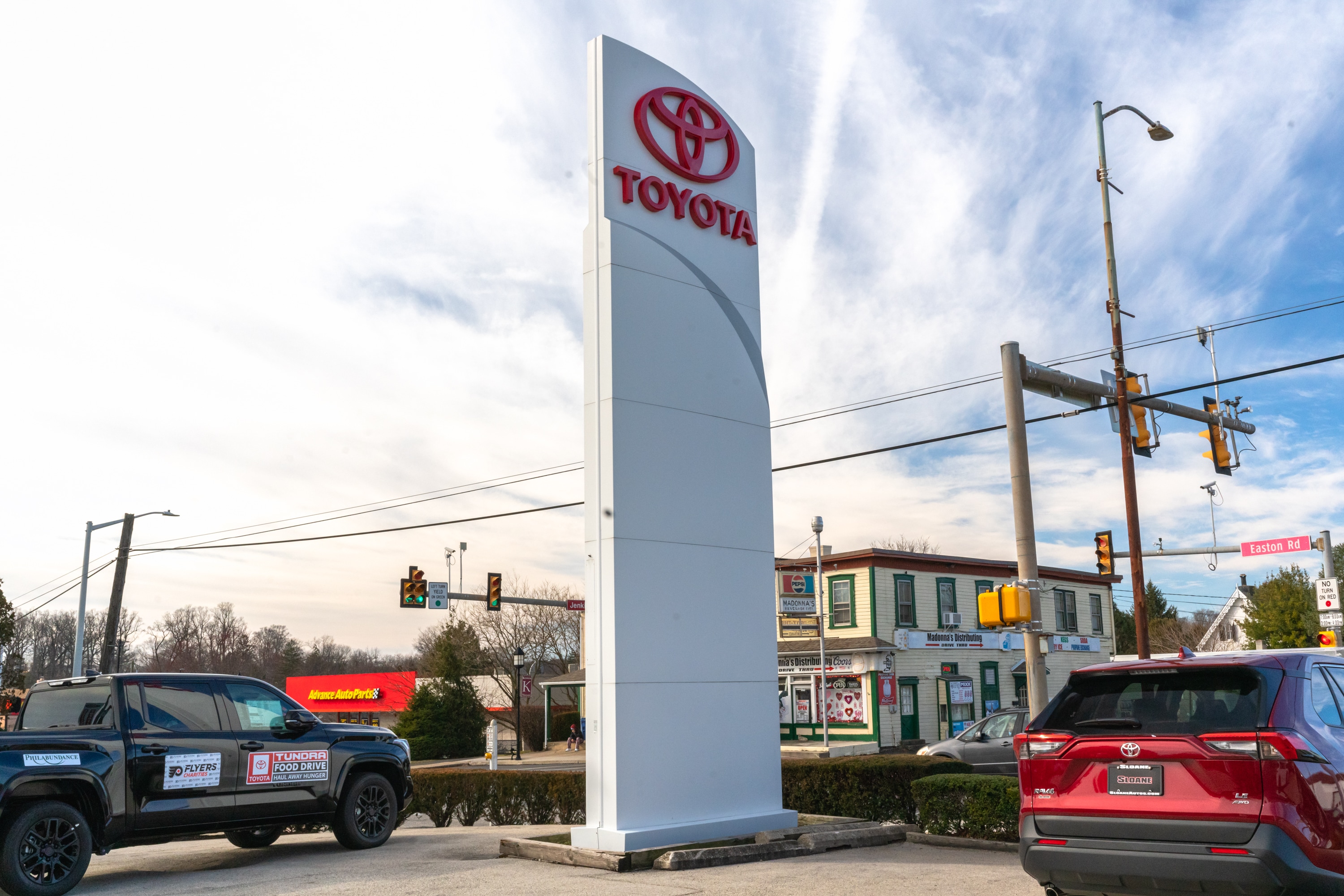 Toyota sign in front of Sloane Toyota's dealership in the heart of Glenside, PA.