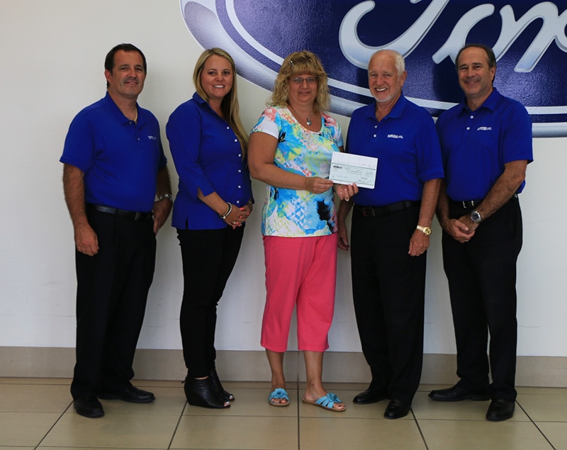 Becky Davis with the Smails Presenting Check for Troops First Foundation 600 × 392