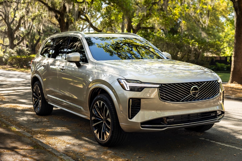 Silver Volvo XC90 parked beneath trees