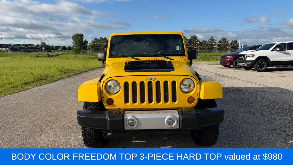 Used 2011 Jeep Wrangler Unlimited Sahara with VIN 1J4BA5H14BL553715 for sale in Midland, MI