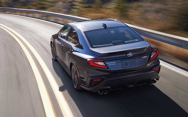 A 2022 Subaru WRX driving down a highway