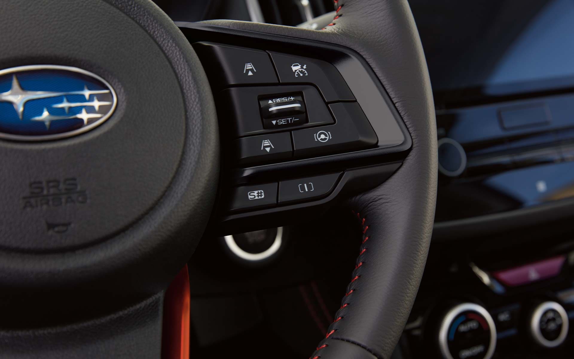 A close-up on the steering wheel controls for SI-DRIVE on the 2022 Forester Sport.