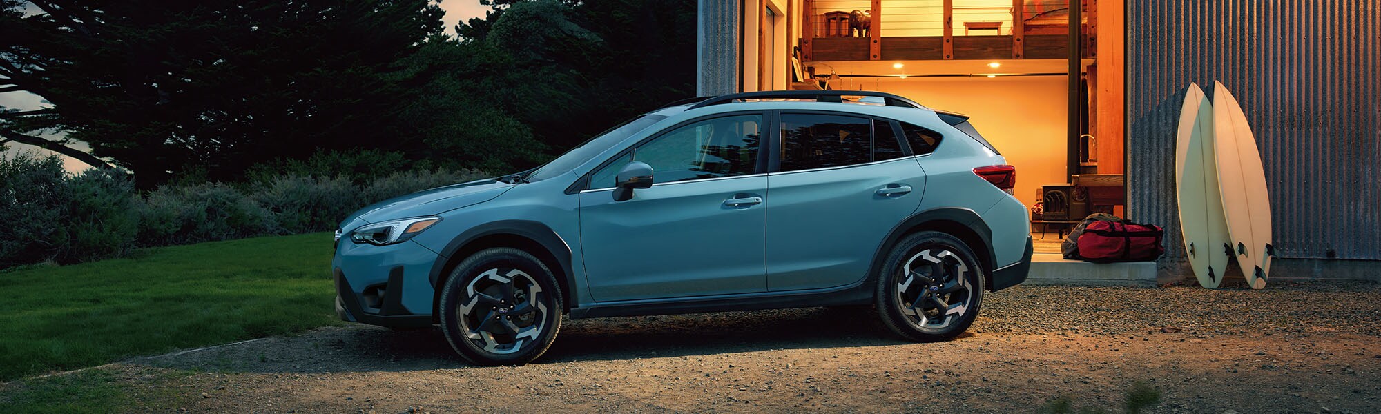 A 2023 Crosstrek parked outside of a garage.