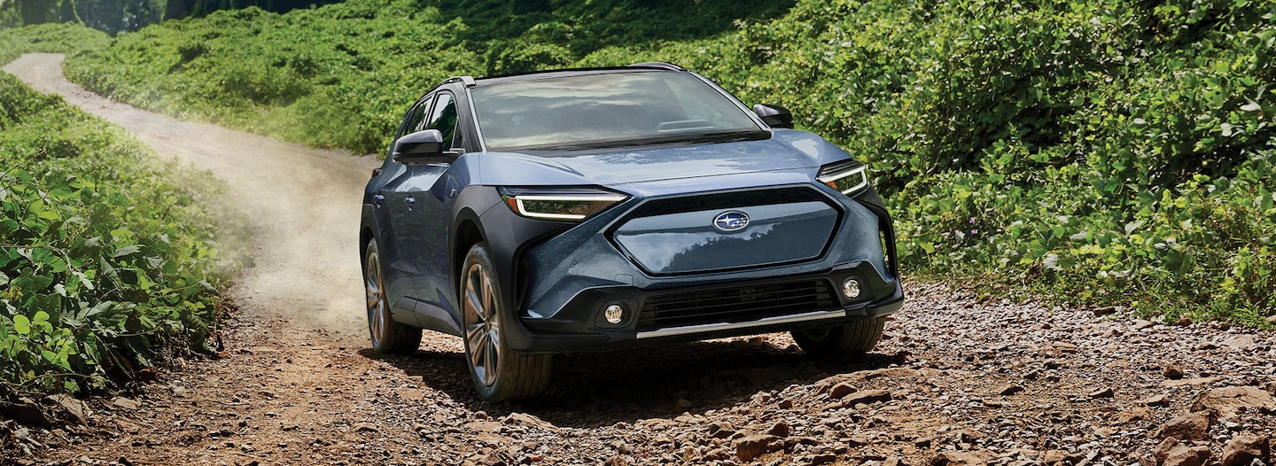 A 2023 Solterra driving on a dirt road.