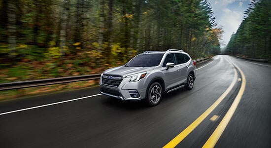 The 2022 Subaru Forester driving on a road