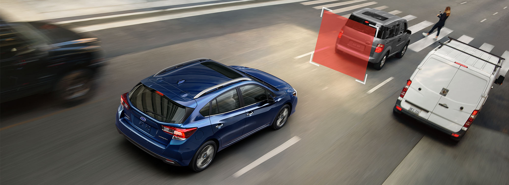  A photo illustration showing Automatic Pre-Collision Braking feature of the 2023 Impreza hatchback.