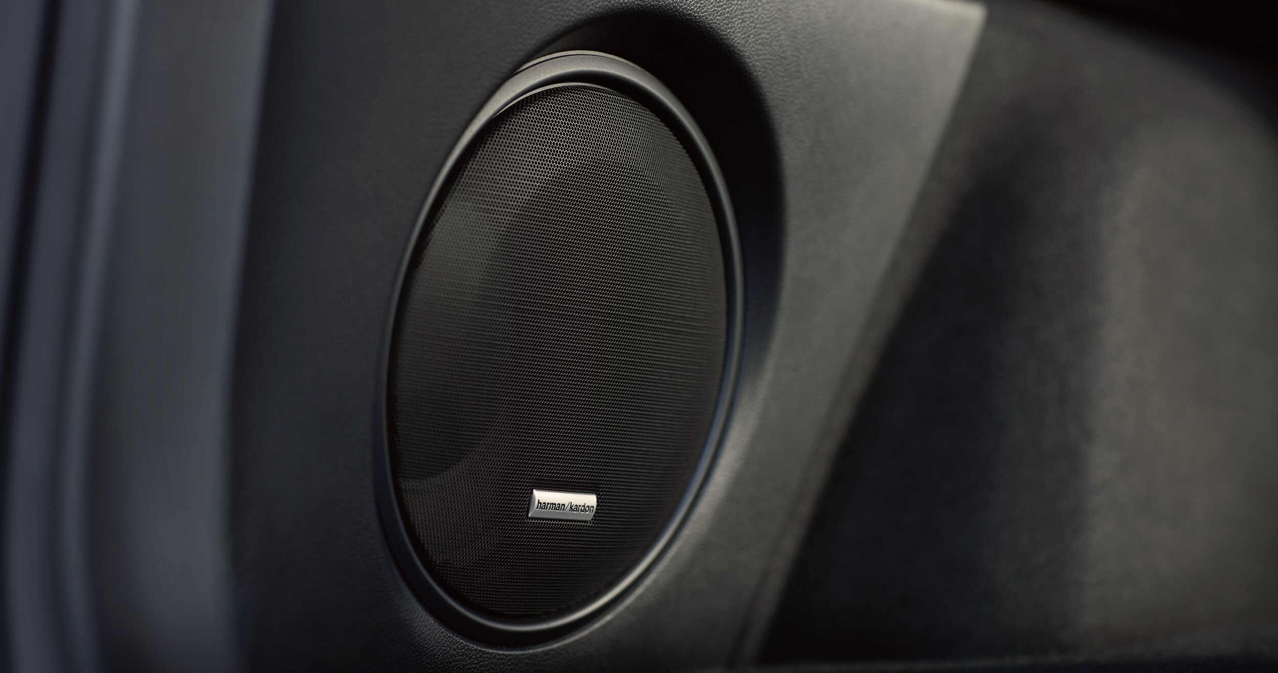 A close-up of one of the speakers for the Harman Kardon premium audio system available on the 2023 Outback.